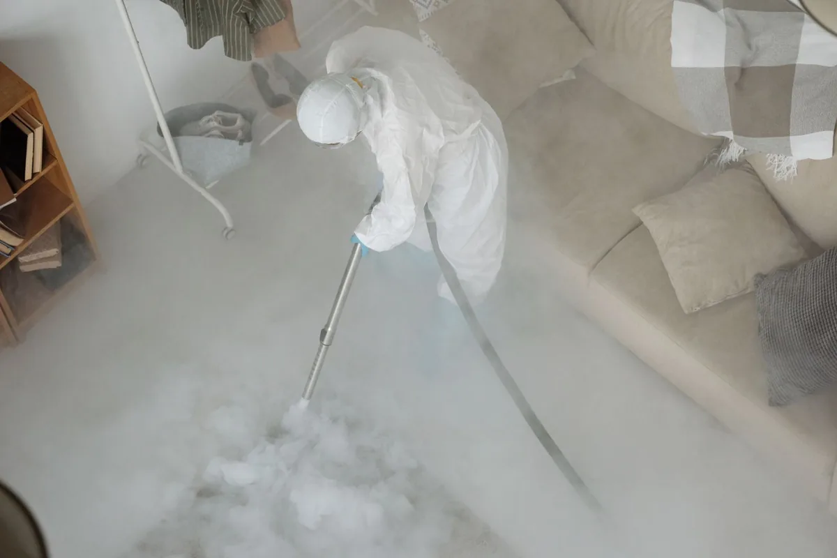 Biohazard cleanup technician in protective equipment, Chico, WA